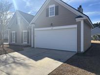 Charming single-Gathering home with neutral siding, a two-car garage and a well-maintained lawn at 1501 Sweet Myrtle Circle Cir, Mount Pleasant, SC 29466