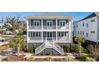 Two-story home with gray siding, white trim, and a large front porch at 1646 Red Tide Rd, Mount Pleasant, SC 29466