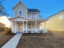 Two-story house with front porch and landscaping at 217 Forsythia Ave, Summerville, SC 29483