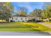 White Ranch style home with green lawn and driveway at 2729 Hunt St, Charleston, SC 29414