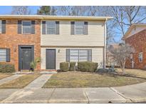 Brick and beige two-story townhouse with landscaping and sidewalk at 415 Parkdale Dr # 16-F, Charleston, SC 29414