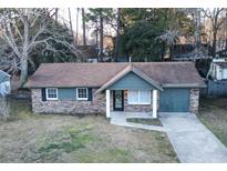 Brick ranch home with a grey exterior, landscaped yard, and driveway at 994 Margaret Dr, Ladson, SC 29456