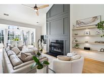 Spacious living room featuring a modern fireplace and built-in shelving at 2737 Sarazen Dr, Mount Pleasant, SC 29466