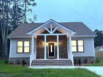 Attractive Craftsman style home with stone accents and a welcoming front porch at 104 Del Ray Dr, Walterboro, SC 29488