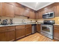 Modern kitchen with stainless steel appliances and granite countertops at 1240 Fairmont Ave # 1, Mount Pleasant, SC 29464