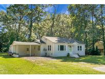 Charming white bungalow with carport and landscaped lawn at 332 Howle # A&B, Charleston, SC 29412