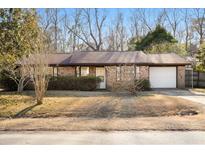 Brick ranch house with attached garage and landscaping at 116 Eagle Dr, Summerville, SC 29485