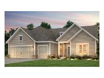 Two-story home with light brown siding, two-car garage, and landscaped lawn at 2086 Cousteau Ct, Johns Island, SC 29455
