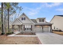 Craftsman style home with stone accents and a two-car garage at 226 Comiskey Park Cir, Summerville, SC 29485