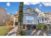Attractive townhome with landscaping and a walkway at 329 Flyway Rd, Goose Creek, SC 29445