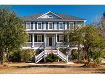 Two-story house with gray siding, white columns, and a large front porch at 3734 Saint Ellens Dr, Mount Pleasant, SC 29466