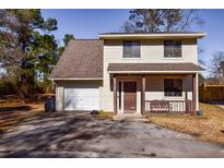 House exterior featuring a garage and front porch at 107 Willow Ct, Summerville, SC 29486