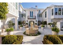 Elegant courtyard with fountain, lush landscaping, and comfortable seating at 2723 Bayonne St, Sullivans Island, SC 29482