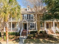 Two-story townhome with front porch, brick steps, and mature landscaping at 2971 Treadwell St St, Mount Pleasant, SC 29466