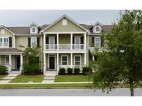 Two-story townhome with front porch and landscaping at 3419 Fairwater Pl, Mount Pleasant, SC 29466