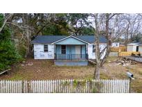 Blue house with a front porch undergoing renovations at 3995 Gary Dr, North Charleston, SC 29405