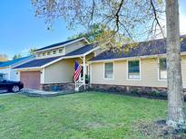 House exterior featuring a two-car garage and well-maintained lawn at 8025 Eberly Ave, North Charleston, SC 29420