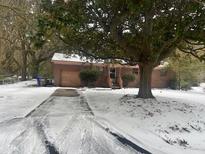 Ranch style home with attached garage, covered entry, and spacious yard at 1428 Jeffords St, Charleston, SC 29412