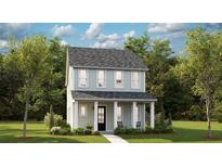 Two-story light green house with a front porch and landscaping at 1443 Clay Field Trl, Summerville, SC 29485