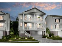 Two-story home with gray siding, balconies, and a attached garage at 1687 Siloh St # 496, Mount Pleasant, SC 29466
