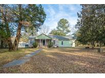 Ranch style home with brick accents and a spacious lawn at 2042 Sc-402, Moncks Corner, SC 29461