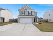 Two-story house with gray siding, white garage door, and a landscaped lawn at 230 Wathen Dr, Goose Creek, SC 29445