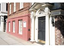 Historic brick home with charming columns and updated entryway at 286 Meeting St # J, Charleston, SC 29401