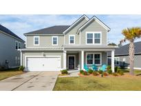 Two-story house with gray siding, white trim, and a front porch at 230 Granton Edge Ln, Summerville, SC 29486