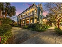 Historic two-story home with wraparound porch and landscaped yard at 66 Warren St # Entire Property, Charleston, SC 29403