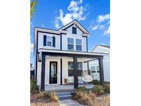 Charming two-story home with white siding, black accents, and a welcoming front porch at 111 Crimson St, Summerville, SC 29486
