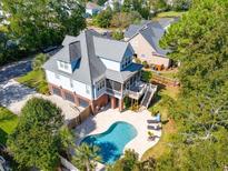 Aerial view of two story home with pool and detached garage at 1160 Rivers Reach Dr, Wando, SC 29492