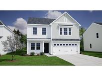 Two-story house with white siding, gray roof, and a two-car garage at 2018 O'Leary Cir, Summerville, SC 29483