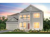 Two-story home with gray siding, balcony, and attached garage at 2082 Cousteau Ct, Johns Island, SC 29455