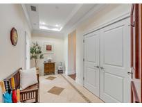 Elegant hallway featuring neutral walls, tile floors, and decorative accents at 355 Cooper River Dr, Mount Pleasant, SC 29464