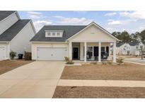 Craftsman style home with front porch and two-car garage at 117 Upper Trestles Ave, Summerville, SC 29483