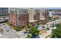 Aerial view of a modern brick building, with ample parking and city views at 150 Bee St # 318, Charleston, SC 29401