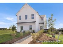 Two-story white farmhouse with landscaping and walkway at 181 Surfbird Rd # 508, Summerville, SC 29486