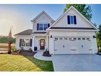 Charming two-story white home with an attached two-car garage and manicured landscaping at 108 Crosscut Ln, Summerville, SC 29486