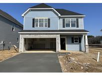 Charming two-story home featuring blue siding, black shutters, and an attached two-car garage at 109 O'Leary Cir, Summerville, SC 29483
