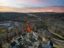Aerial view of a charming house community near the water at 1962 Gracewood Dr, Charleston, SC 29414