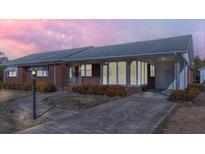 Charming brick home featuring a covered porch and well-maintained landscaping at 2830 Wire Rd, Saint George, SC 29477