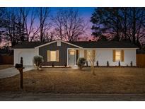 Charming single-story home with a combination of brick and siding and manicured lawn at 3 Coral Dr, Goose Creek, SC 29445