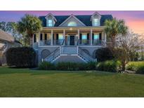 Two-story home with front porch and landscaped yard at 3304 Rees Row, Mount Pleasant, SC 29466