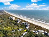 Aerial view of beachfront property, showcasing oceanfront location and community at 4416 Sea Forest Dr, Kiawah Island, SC 29455