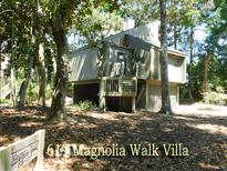 Inviting villa featuring a raised foundation, charming exterior and ample natural light at 619 Magnolia Walk Villas, Edisto Island, SC 29438