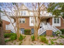 Charming townhouse with a red brick facade and welcoming entrance staircase at 620 Windermere Blvd # 6A, Charleston, SC 29407