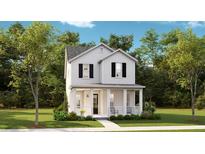 Charming two-story white home featuring a welcoming front porch and beautifully landscaped yard at 144 Maritime Way, Summerville, SC 29485