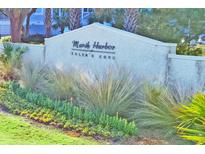 Stone Marsh Harbor sign with lush, ornamental landscaping at Toler's Cove at 1608 Marsh Harbor Ln # C, Mount Pleasant, SC 29464