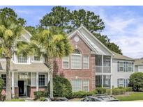 Charming multi-story condo with brick facade and manicured landscaping at 1652 Camfield Ln, Mount Pleasant, SC 29466