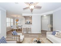 Staged living room with modern decor, open floor plan, and lots of light at 1712 Chatelain Way, Mount Pleasant, SC 29464